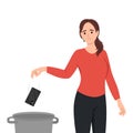 Woman throws mobile phone into the trash. Concept of digital detox, disconnecting, mediastika, device free zone, internet Royalty Free Stock Photo