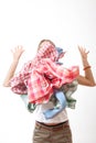 Woman throws a pile of clothes, isolated on white Royalty Free Stock Photo