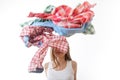 Woman throws a pile of clothes, isolated on white Royalty Free Stock Photo