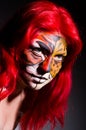 Woman with tiger face in halloween Royalty Free Stock Photo