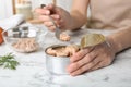 Woman with tin can of conserved tuna