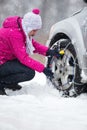 Woman with tire chains Royalty Free Stock Photo