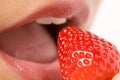 Woman about to eat a strawberry