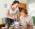 Woman to make bracelet with elastic bands