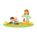 Woman with toddlers sitting on round carpet and playing in educational game for speech development. Flat people Royalty Free Stock Photo