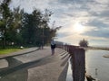 A woman took leisure walk in Tanjung Api waterfront.