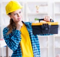 Woman with toolkit in workshop Royalty Free Stock Photo