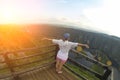 Woman on the top of the hill and panorama of Canyon Uvac in Serbia. At wooden platform view point