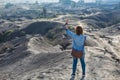 Woman on top of Layer Volcanic ash as sand ground of Mount Bromo volcano (Gunung Bromo) at Bromo Tengger Semeru National Park, Ea Royalty Free Stock Photo