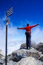 Woman on top of mountain