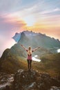 Woman on the top of mountain happy raised hands hiking alone outdoor travel in Norway summer vacations healthy lifestyle Royalty Free Stock Photo