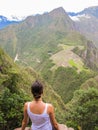 Woman at the top of Wayna Picchu mountain in Machu Picchu Royalty Free Stock Photo