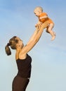 A woman tosses a child Royalty Free Stock Photo