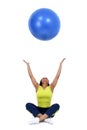 Woman tossing blue ball