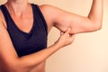 Woman touches her tricep. People, healthcare and beauty concept Royalty Free Stock Photo