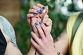 Woman Touching Hand Of Her Boyfriend