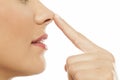 Woman touching her nose Royalty Free Stock Photo