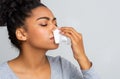 Woman touching her nose with napkin, bleeding Royalty Free Stock Photo