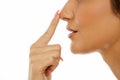 Woman touching her nose Royalty Free Stock Photo