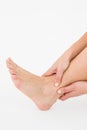 Woman touching her painful ankle Royalty Free Stock Photo