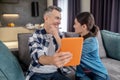 Woman touching husband face with tablet Royalty Free Stock Photo