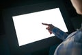 Woman touching interactive white blank touchscreen display kiosk at exhibition Royalty Free Stock Photo