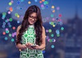 Woman touching phone against Night city with connectors Royalty Free Stock Photo