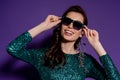 Woman touching sunglasses and smiling on Royalty Free Stock Photo