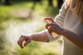 Woman tourist applying mosquito repellent on hand during hike in nature
