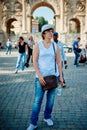 Woman tourist on the background of arch of Constantine