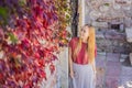 Woman tourist on background of beautiful view of the island of St. Stephen, Sveti Stefan on the Budva Riviera, Budva Royalty Free Stock Photo