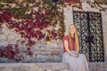 Woman tourist on background of beautiful view of the island of St. Stephen, Sveti Stefan on the Budva Riviera, Budva Royalty Free Stock Photo