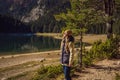 Woman tourist in background of Panoramic morning view of Black Lake Crno Jezero. Calm summer scene of Durmitor Royalty Free Stock Photo