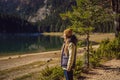 Woman tourist in background of Panoramic morning view of Black Lake Crno Jezero. Calm summer scene of Durmitor Royalty Free Stock Photo