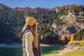 Woman tourist in background of Panoramic morning view of Black Lake Crno Jezero. Calm summer scene of Durmitor Royalty Free Stock Photo