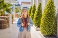 Woman tourist on background of Yacht marina, beautiful Mediterranean landscape in warm colors. Montenegro, Kotor Bay Royalty Free Stock Photo