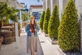 Woman tourist on background of Yacht marina, beautiful Mediterranean landscape in warm colors. Montenegro, Kotor Bay Royalty Free Stock Photo