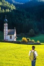 Woman-tourist with backpack in Dolomites