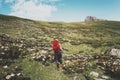 Woman tourist with backpack hiking in mountains Travel Lifestyle adventure concept summer vacations outdoor Royalty Free Stock Photo