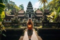 Woman tourist in Bali, Ubud, Indonesia. Travel concept, A tourist woman with a backpack on vacation, walking through the Hindu