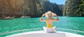 Woman tourist on boat trip, happy traveller relaxing at Pileh lagoon on Phi Phi island, Krabi, Thailand. Exotic landmark,