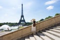 Woman tourist is enjoy siteseeing Eiffle Tower landmark of France, Paris during summer