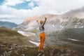 Woman tourist enjoying lake view in mountains travel hiking outdoor adventure active vacations Royalty Free Stock Photo