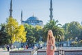 Woman tourist enjoying the view Blue Mosque, Sultanahmet Camii, Istanbul, Turkey Royalty Free Stock Photo