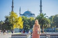 Woman tourist enjoying the view Blue Mosque, Sultanahmet Camii, Istanbul, Turkey Royalty Free Stock Photo