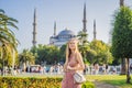 Woman tourist enjoying the view Blue Mosque, Sultanahmet Camii, Istanbul, Turkey Royalty Free Stock Photo