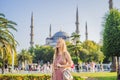 Woman tourist enjoying the view Blue Mosque, Sultanahmet Camii, Istanbul, Turkey Royalty Free Stock Photo