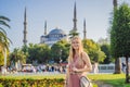 Woman tourist enjoying the view Blue Mosque, Sultanahmet Camii, Istanbul, Turkey Royalty Free Stock Photo