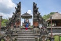 A woman tourist is enjoying the view of old cultural sculpture at the entrance of gate of heaven as a part of asian history in