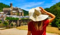 Woman tourist in France, beautiful village in Aveyron